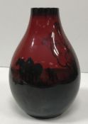 A Royal Doulton flambé vase decorated with plough team 21 cm high