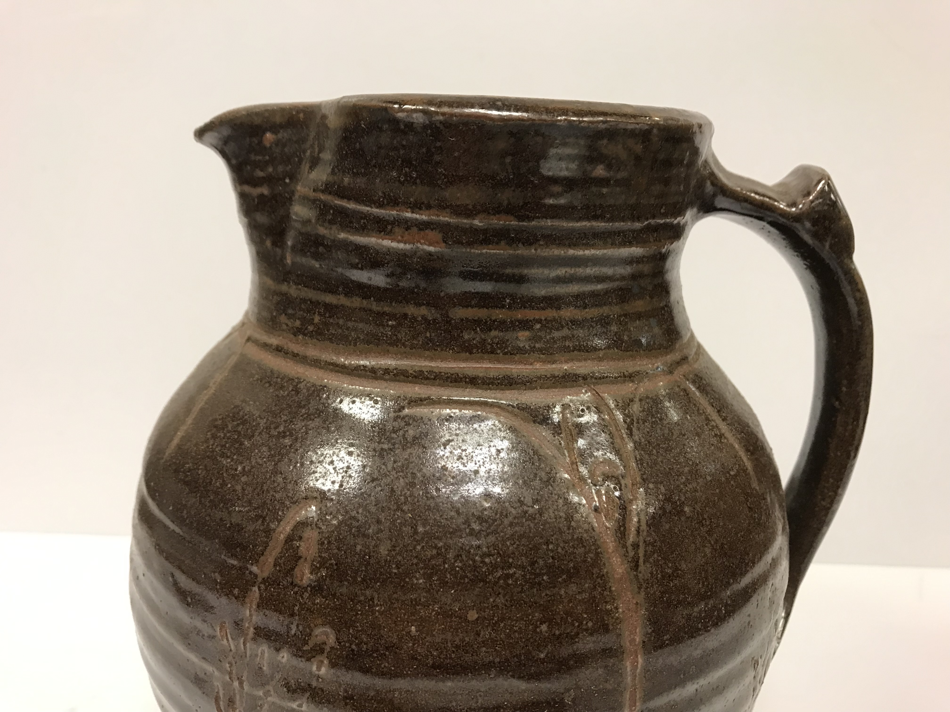 A Michael Cardew Wenfordbridge Pottery brown glazed ribbed jug with stylized floral spray - Image 9 of 22