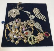 A collection of vintage paste necklaces and brooches, together with a box of vintage bracelets,