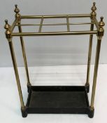 A brass and cast metal six section stick stand, the base stamped "Made in England JANS225",