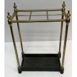 A brass and cast metal six section stick stand, the base stamped "Made in England JANS225",