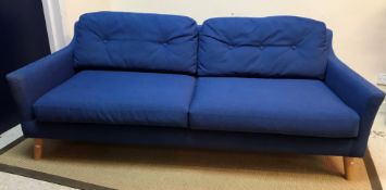 A modern blue upholstered sofa on splayed turned oak legs 200 cm wide x 80 cm deep x 72 cm high
