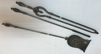 A set of three 19th Century polished steel fire tools comprising tongs, poker and shovel,