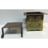 A circa 1900 Arts & Crafts brass jardiniere of square form with embossed stylised foliate and love