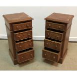 A pair of good quality walnut and feather banded four drawer bedside chests in the Georgian style