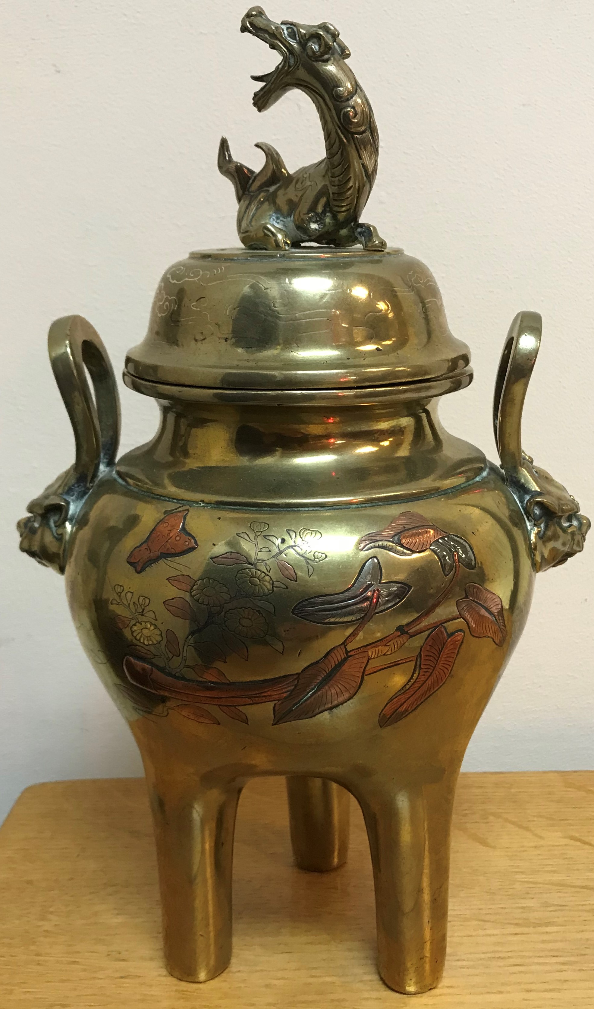 A Chinese brass lidded censer, the lid with dragon finial,