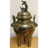 A Chinese brass lidded censer, the lid with dragon finial,