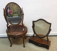 A mahogany toilet mirror with shield shaped plate on a serpentine fronted three drawer base 51.