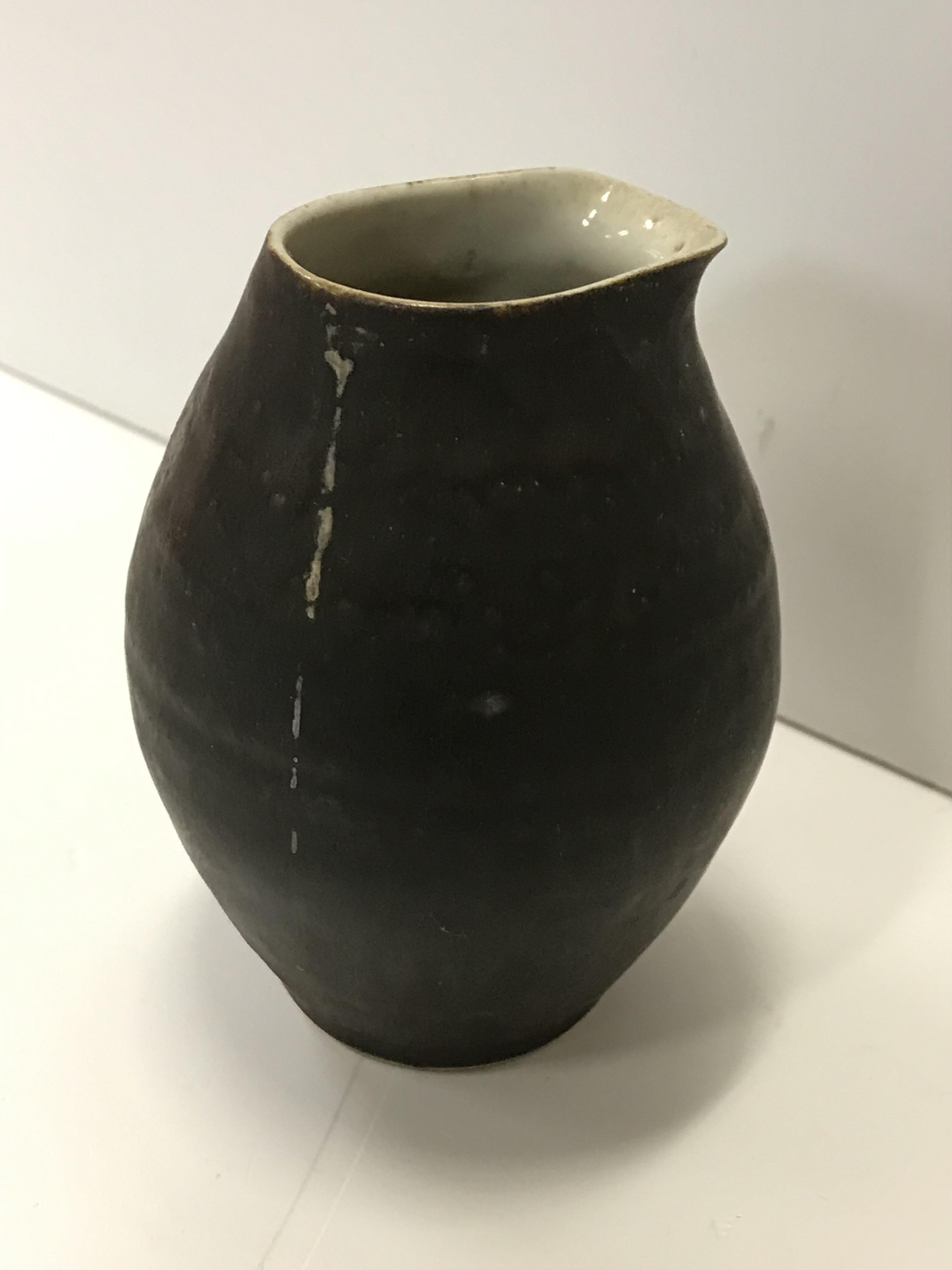 A Lucie Rie pouring vessel, with black glazed exterior and simple design, - Image 2 of 12