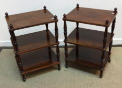 A collection of four mahogany three tier whatnots on turned and ringed supports 44 cm x 35 cm x 66