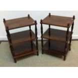 A collection of four mahogany three tier whatnots on turned and ringed supports 44 cm x 35 cm x 66