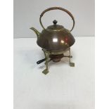 A copper and brass kettle on stand in the Arts & Crafts manner,