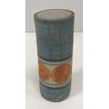 A Troika cylindrical vase with painted circular orange decoration on a blue ground signed "Troika