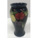 A Moorcroft wisteria plum pattern baluster vase signed and stamped "Moorcroft" to base together