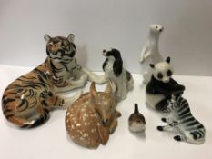 A large collection of Lomonosov USSR animal figurines to include tigers, deer, various dogs, zebra,