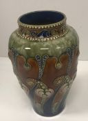 A Frank A Butler Royal Doulton baluster shaped vase with Gothic style relief work foliate