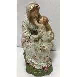 A Wedgwood type pearlware figure group of a mother and child,