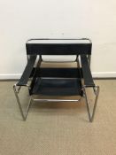 AFTER MARCEL BREUER "Wassily" chair with black leather strapwork on a chrome plated tubular steel