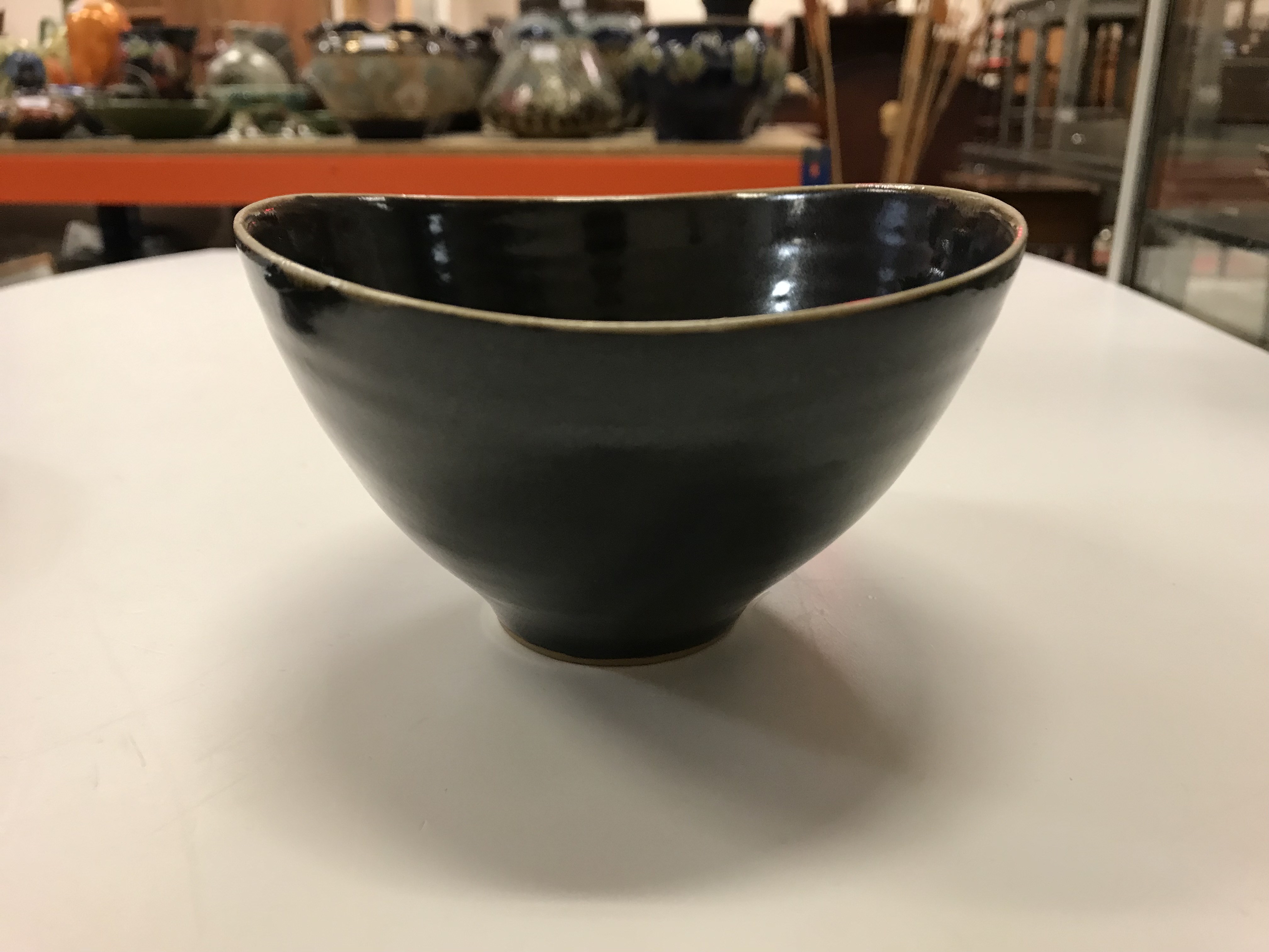 A Lucie Rie black glazed elliptical bowl and saucer, both bearing Lucie Rie marks, - Image 5 of 13