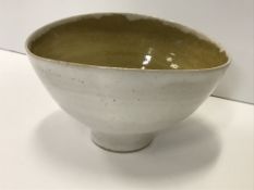 A Lucie Rie and Hans Coper white speckled glazed elliptical bowl with ochre interior,