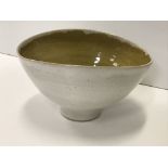 A Lucie Rie and Hans Coper white speckled glazed elliptical bowl with ochre interior,