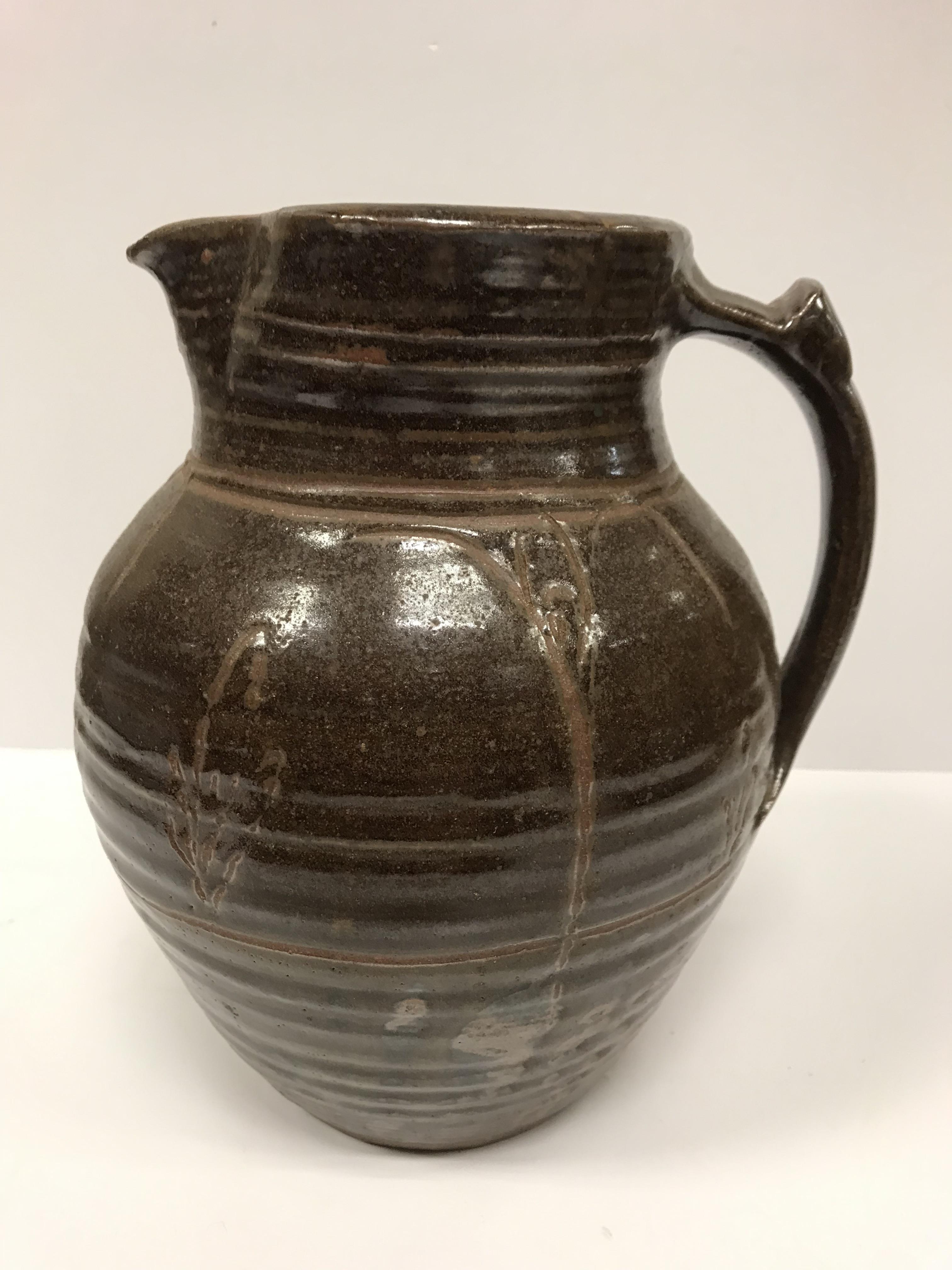 A Michael Cardew Wenfordbridge Pottery brown glazed ribbed jug with stylized floral spray - Image 8 of 22