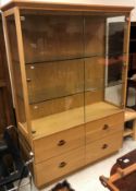 A modern oak display cabinet in the Arts & Crafts style,