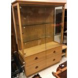 A modern oak display cabinet in the Arts & Crafts style,