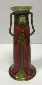 A Minton Secessionist two-handled vase of tapering form on a flared foot,