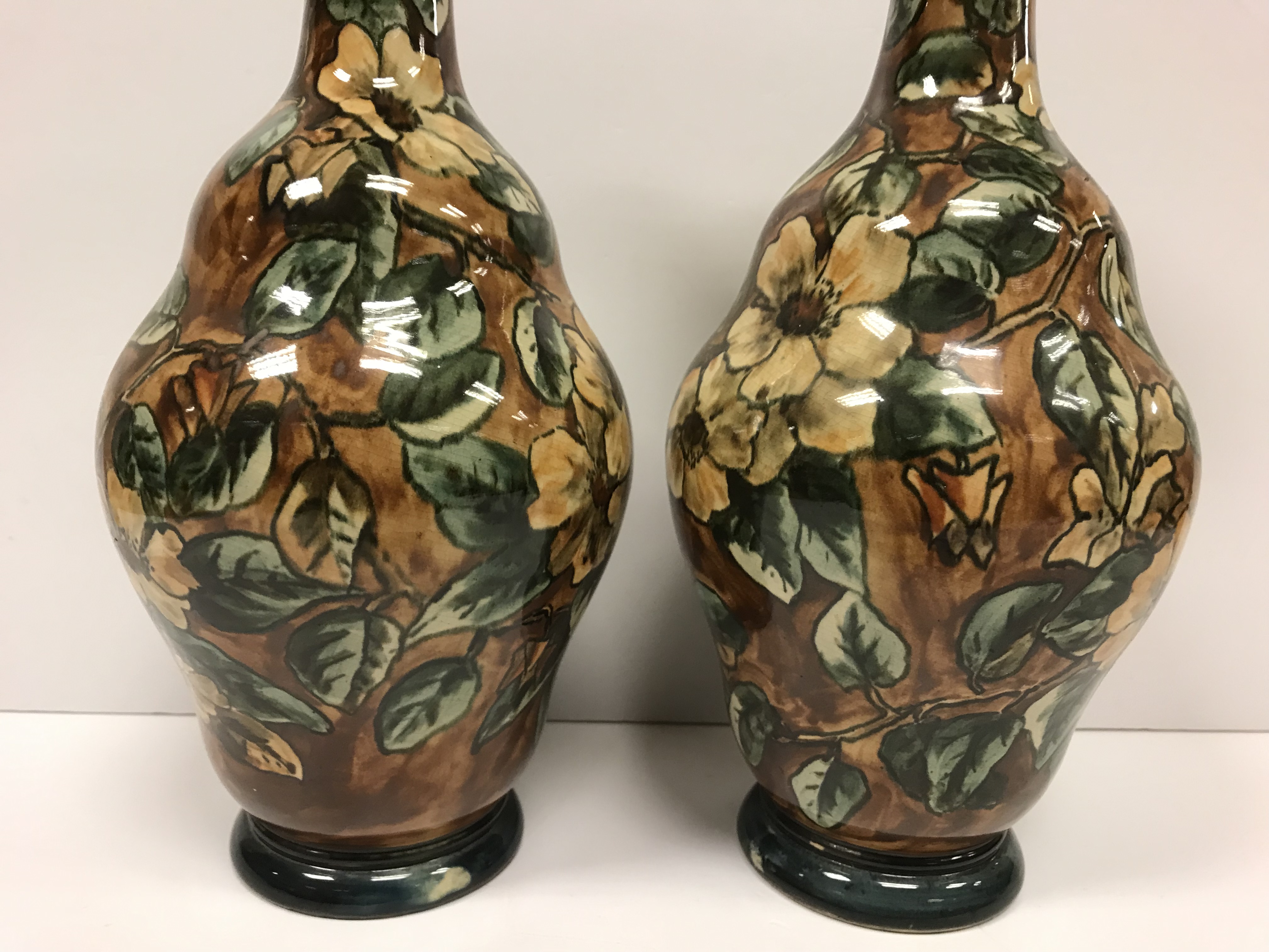 A pair of Doulton Lambeth faience ware vases, the brown ground set with floral decoration, - Image 9 of 22