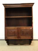 A mahogany wall cabinet with two open shelves over two fielded panel doors 67 cm wide x 27 cm deep