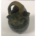 A R W Martin vase of collapsed form with mottled green,