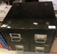 A tin desk top chest of drawers containing a large collection of photographic negatives many