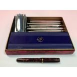 WITHDRAWN A collection of various pens including a Burnham brown marbleised and gold mounted