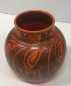 A Pilkington's Royal Lancastrian vase, orange ground with scrolling foliate decoration,