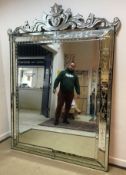 A 20th Century Venetian style mirror of large proportions,