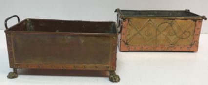 A copper and brass two handled rectangular jardiniere raised on hairy paw claw feet 28.