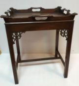 A mahogany tray top occasional table in the Georgian style on square moulded supports with fretwork