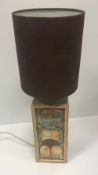 A Troika table lamp of square form with moulded decoration unsigned to base height excluding