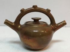 An Elton ware copper lustre twin-spouted teapot 17.