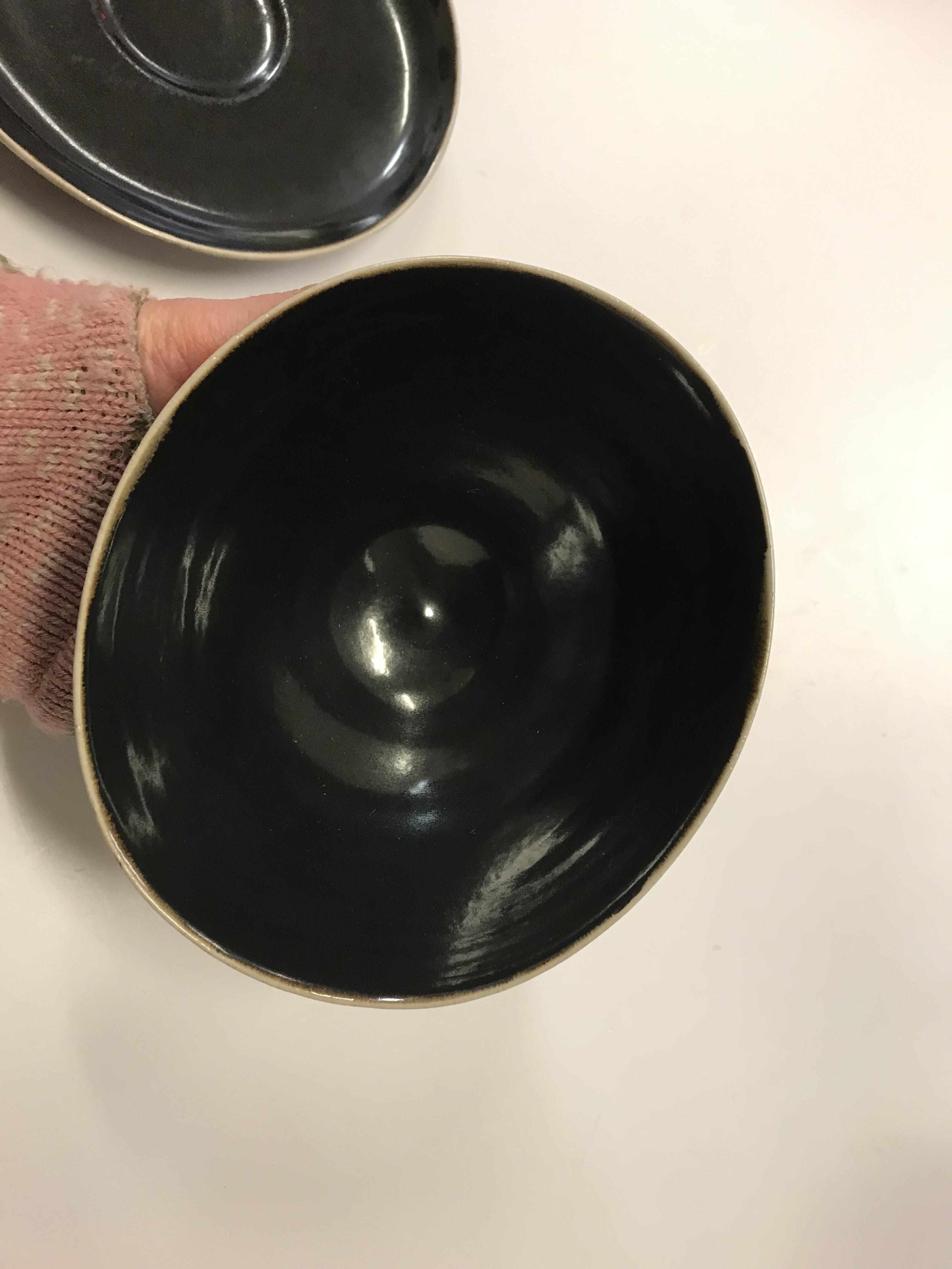 A Lucie Rie black glazed elliptical bowl and saucer, both bearing Lucie Rie marks, - Image 8 of 13