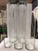 Five large plain cylindrical clear glass vases, varying heights, tallest 80 cm,