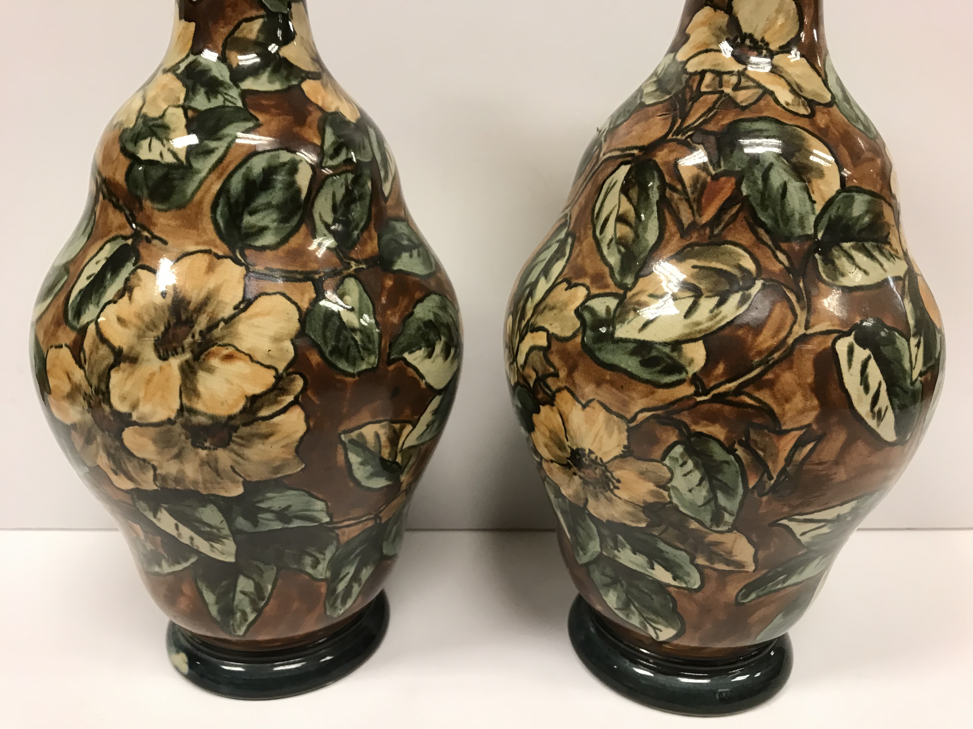 A pair of Doulton Lambeth faience ware vases, the brown ground set with floral decoration, - Image 11 of 22