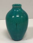 A William de Morgan turquoise vase of ovoid form stamped "De Morgan Merton Abbey" to base 16.