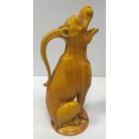 A Burmantofts yellow glazed jug as “Seated howling beast”,