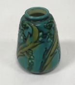 A Minton Secessionist vase of small proportion decorated with foliate and berry decoration on a