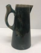 A Wedgwood Christopher Dresser jug of plain conical form with green ground and plated mounts by