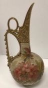 A Doulton Lambeth Carrara ware jug / ewer with scrolling handle and floral spray decoration by