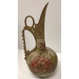 A Doulton Lambeth Carrara ware jug / ewer with scrolling handle and floral spray decoration by