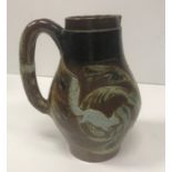 A Martin ware bellied jug decorated with 3 “Running cats amongst foliage”,